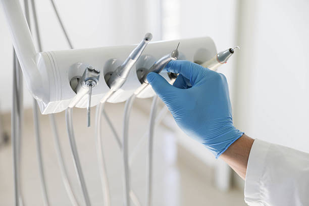 Professional Tooth Extraction technician working in Arlington, TN